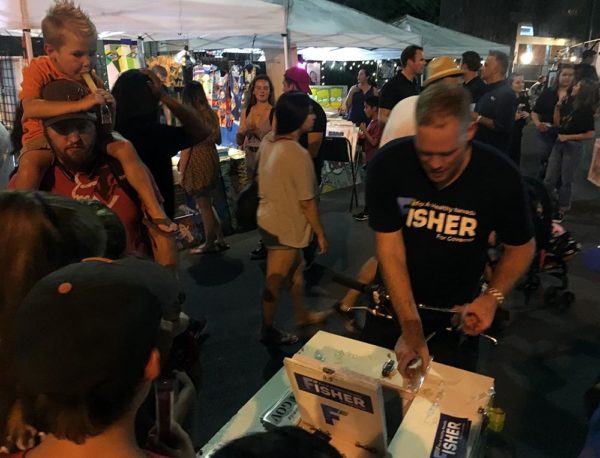 Kevin Ford hands out ice pops for the Fisher for Nevada campaign at First Friday
